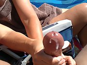 Huge cumshot on the beach milf hand job with cum spewing out from dick